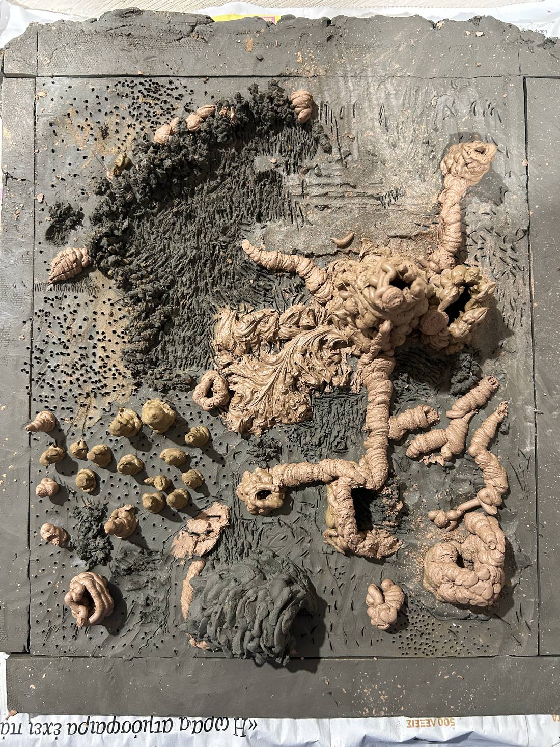 Clay slab with modelled coil forms, seen from above